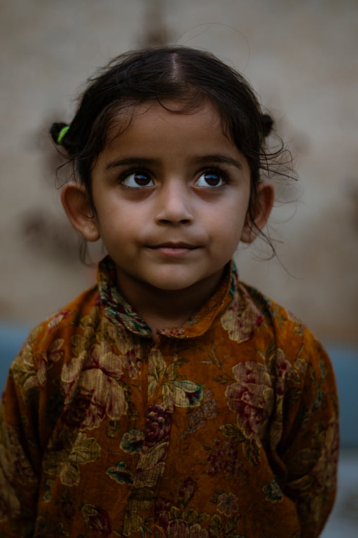 charming-portrait-of-a-child-in-traditional-attire-30076941